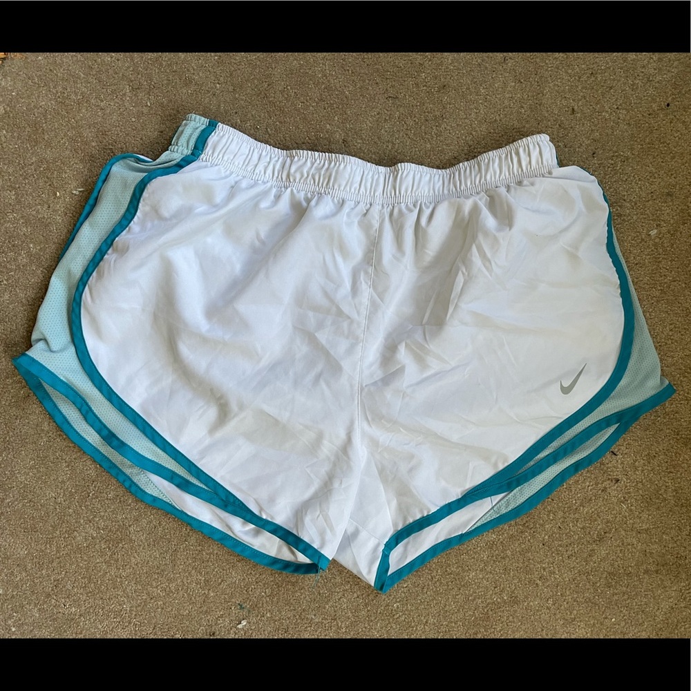 white Nike shorts with blue trim